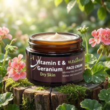 Load image into Gallery viewer, VLEssentials Vitamin E and Geranium dry skin face cream jar on wooden stump with flowers for deep hydration and smooth skin