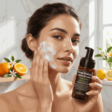Load image into Gallery viewer, woman applying VLEssentials foaming facial wash with orange blossom and lemon for pigmentation and dark spots
