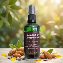 Load image into Gallery viewer, VLEssentials Anti-Ageing Almond &amp; Sunflower Oil Cleanser 100ml bottle with almonds and sunflower seeds on wooden surface
