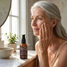 Load image into Gallery viewer, Mature woman applying VLEssentials Vitamin E &amp; Geranium face serum for dry skin hydration and rejuvenation
