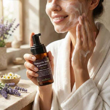 Load image into Gallery viewer, woman applying VLEssentials Chamomile &amp; Lavender foaming facial wash for dry skin
