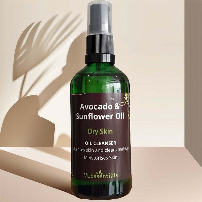 Bottle of Avocado & Sunflower Oil dry skin cleanser with spray cap on beige background